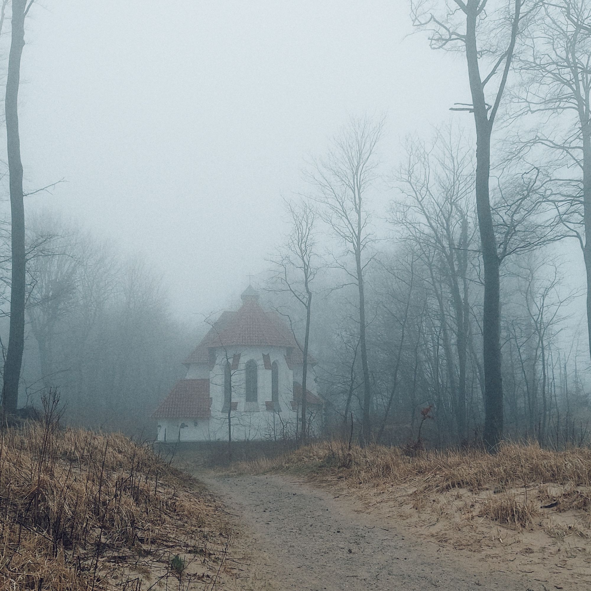 A small church in the fog.