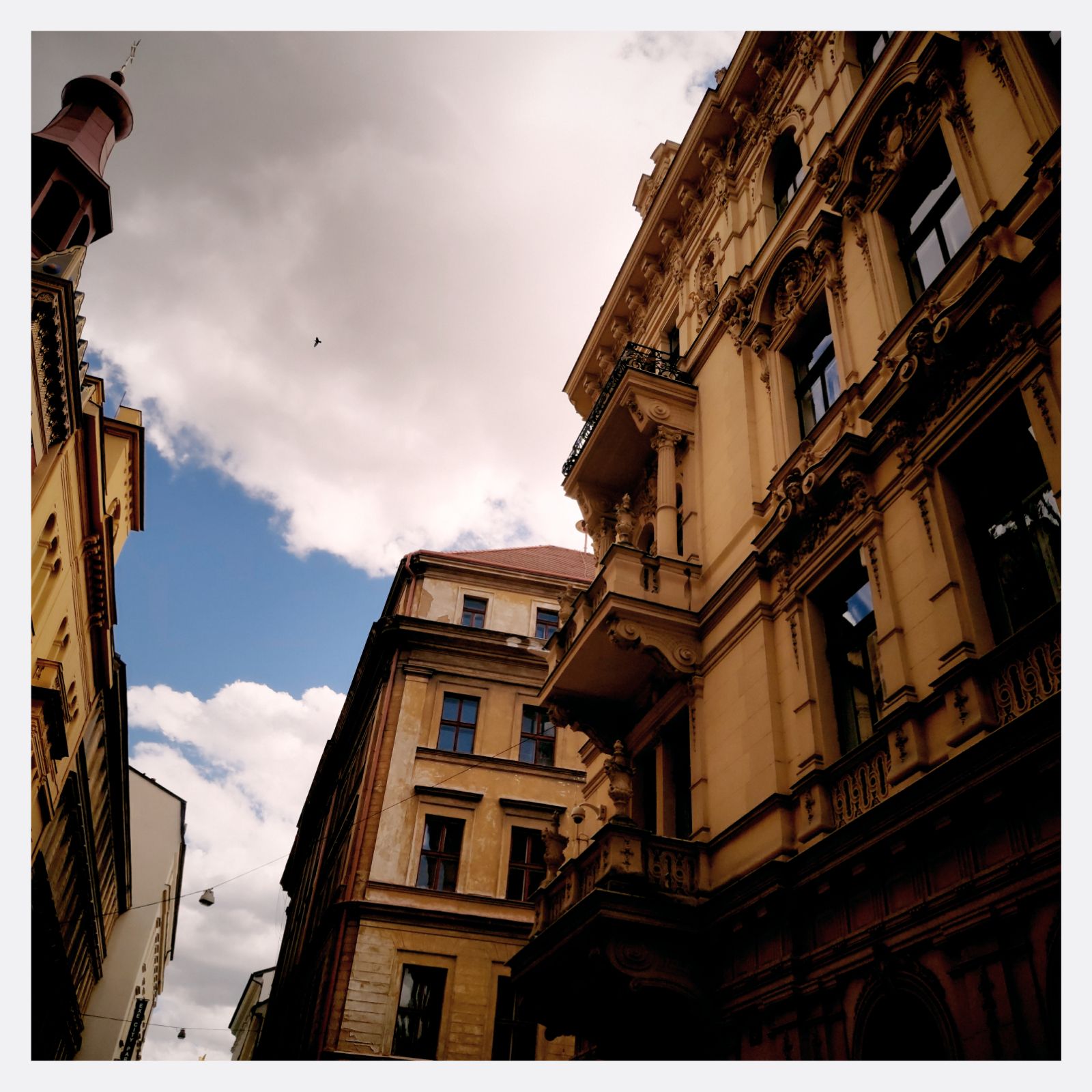 Old building, yellow facade and blue sky.