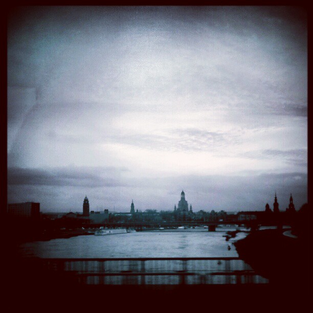 Dresden, city silhouette and Elbe river seen from a bridge.