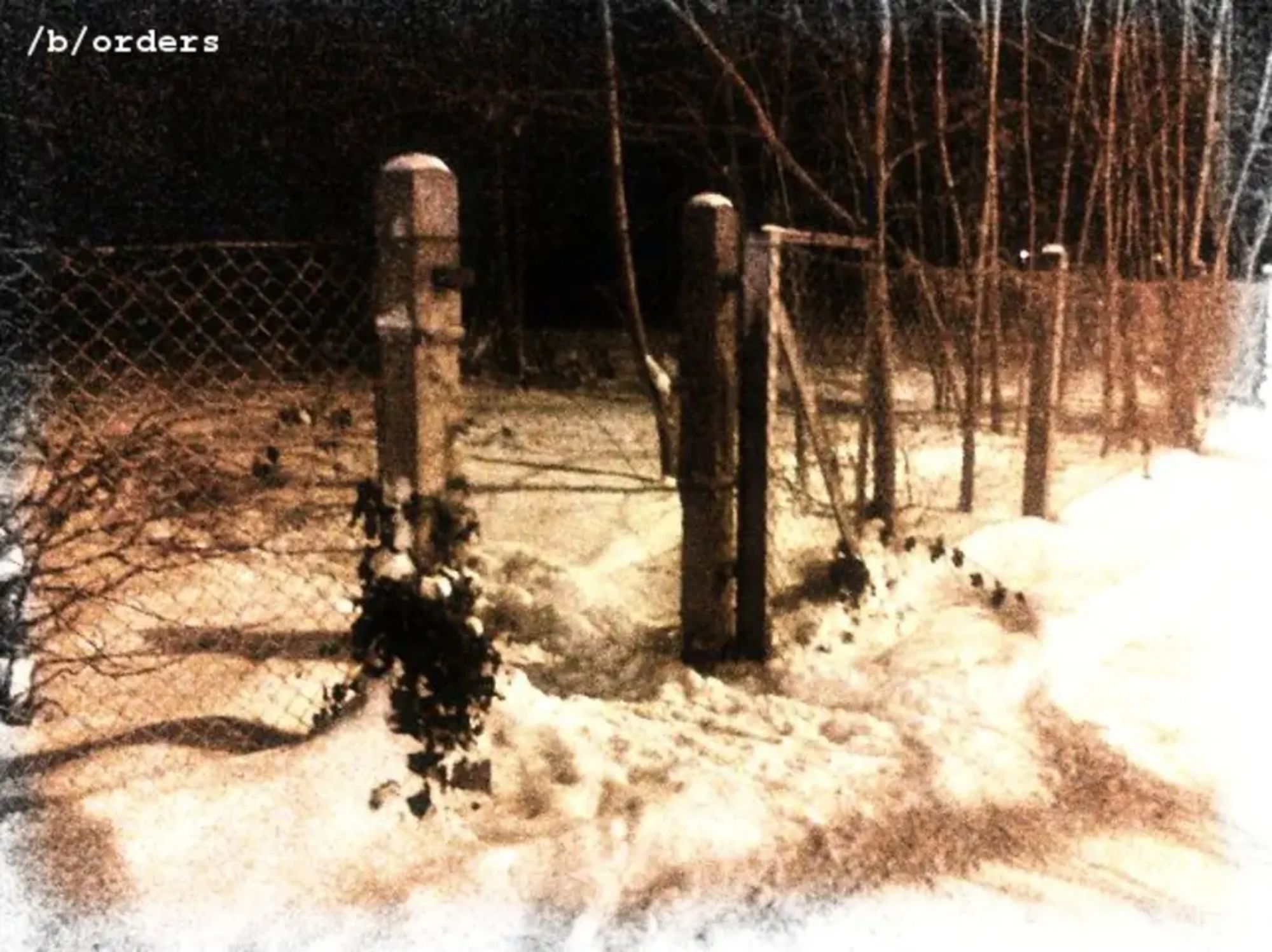 Deep snow, a wire fence and an abandoned gate right through.