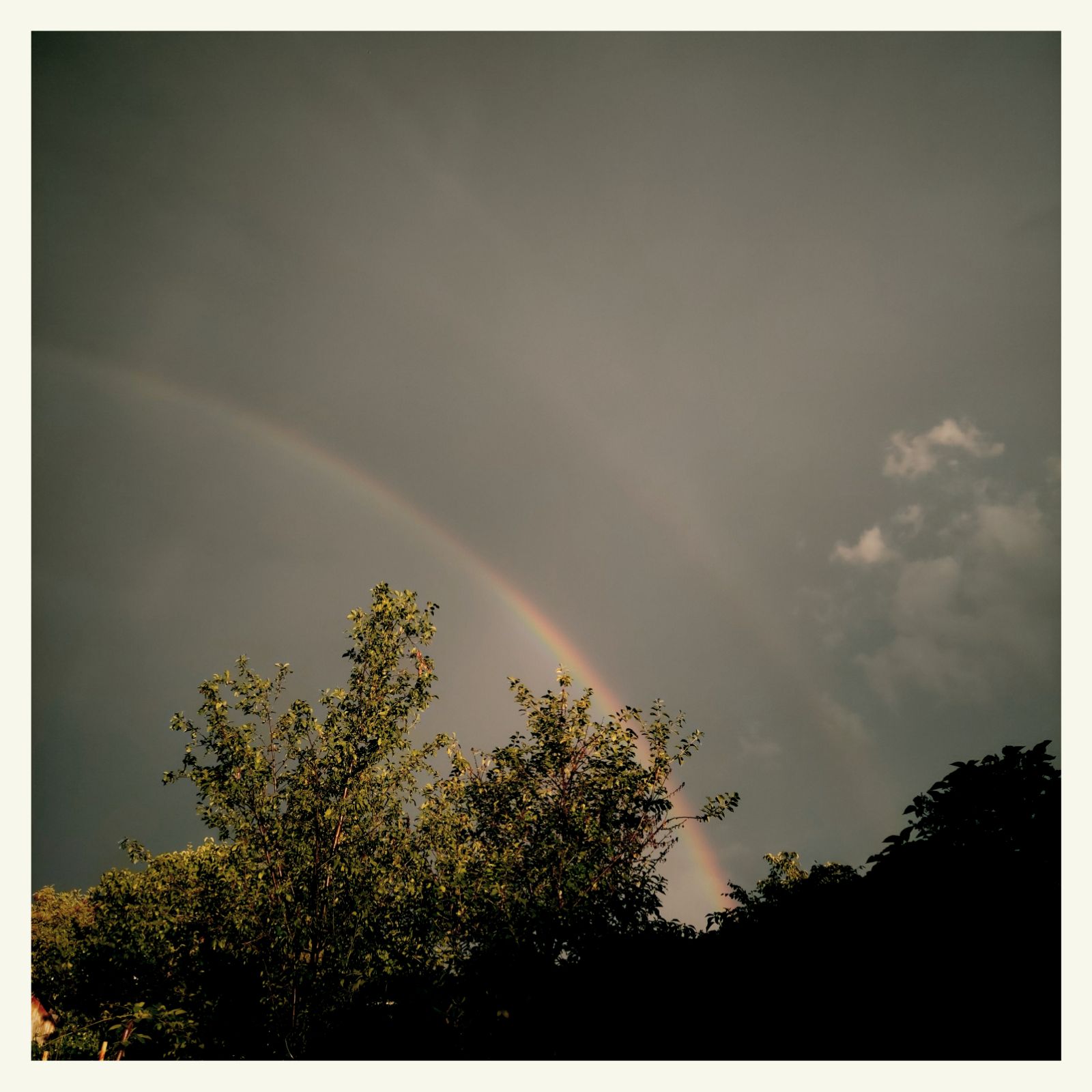 A rainbow in dark skies. After the rain.