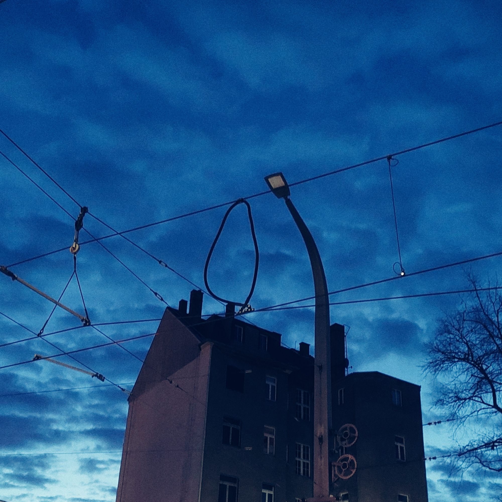 Sunrise sky behind an old building. 