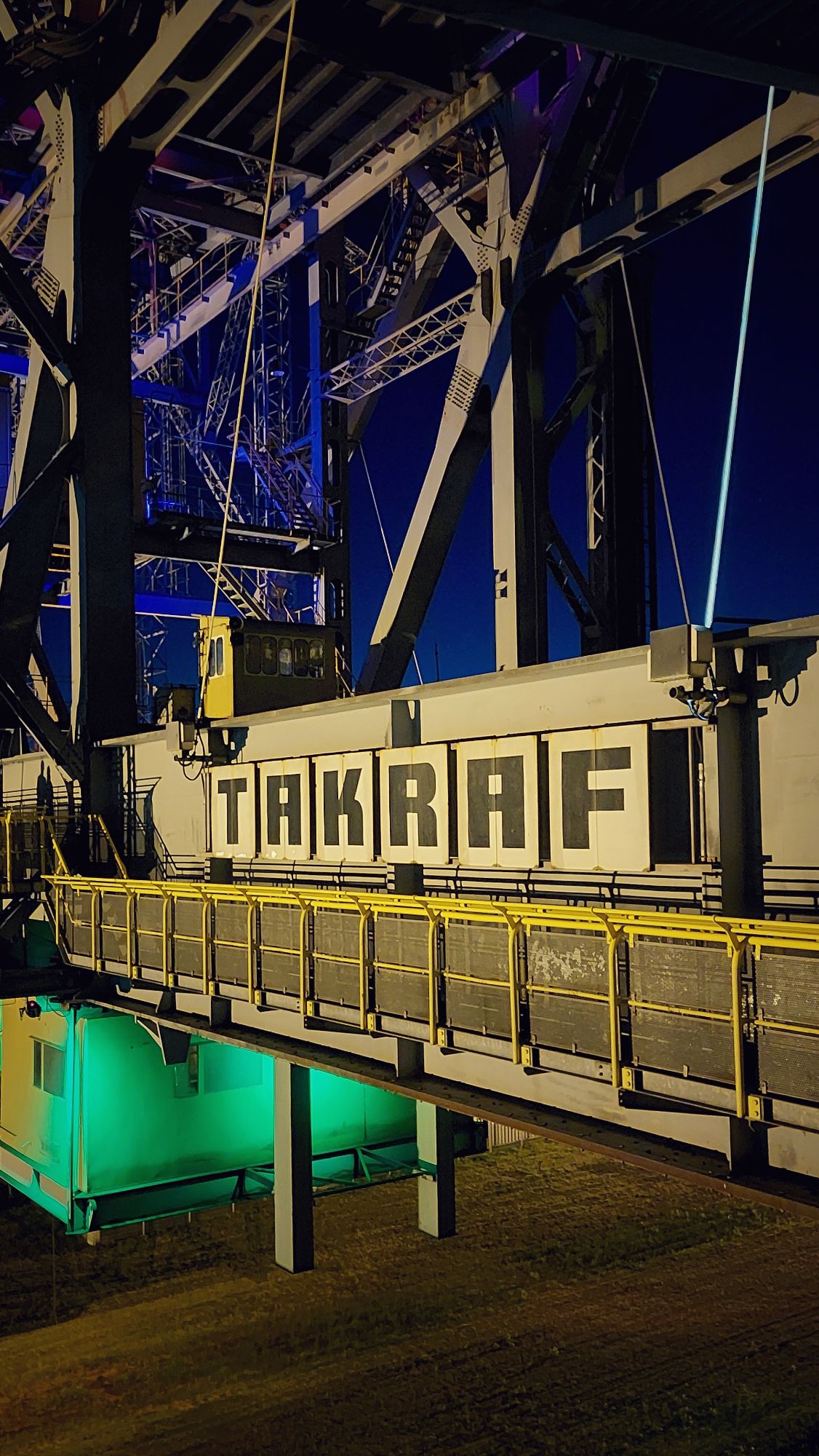 Lower structure of that bridge. Steel pylons 15m above ground. A huge TAKRAF logo.