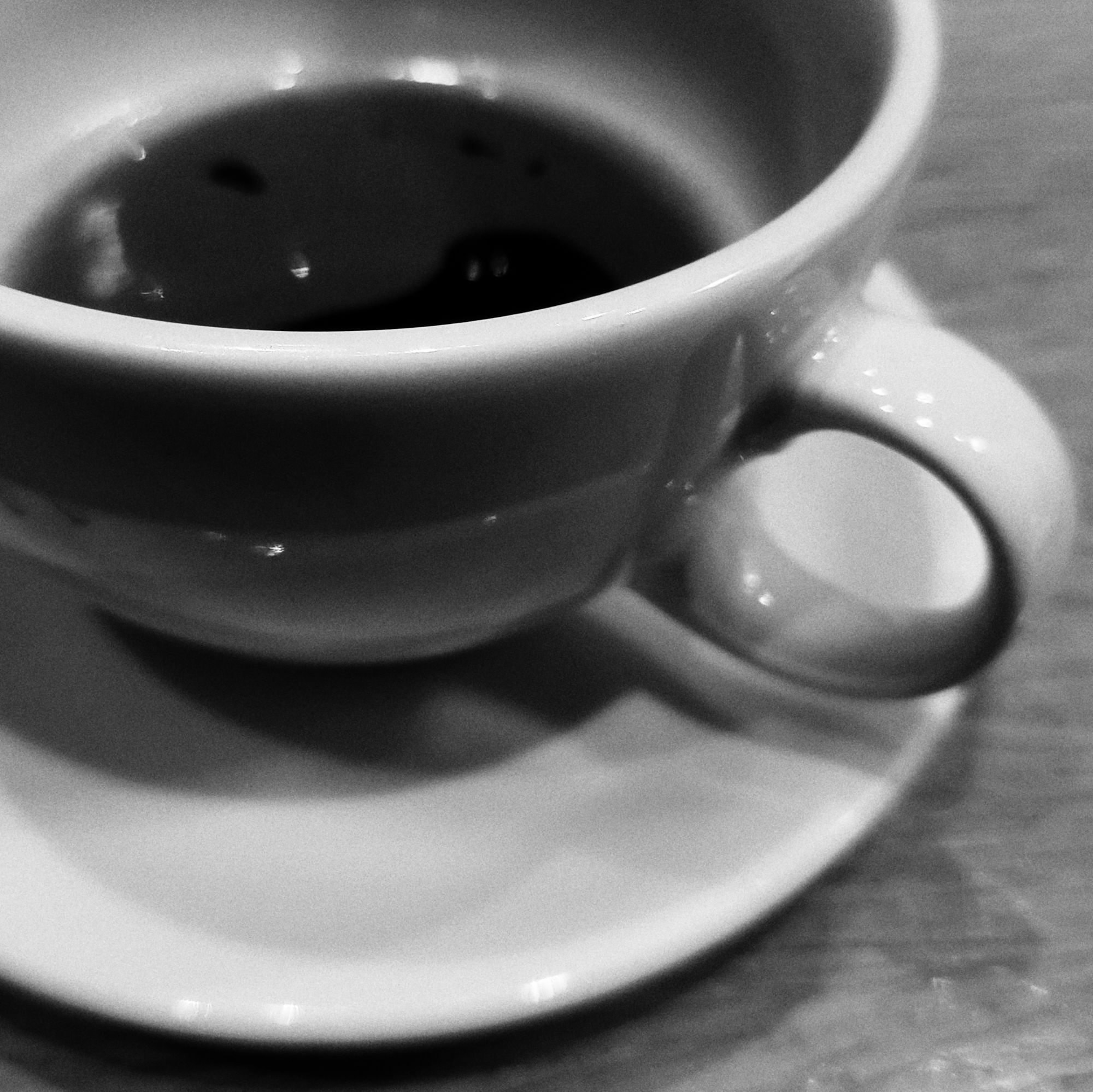 A coffee mug, almost empty. 