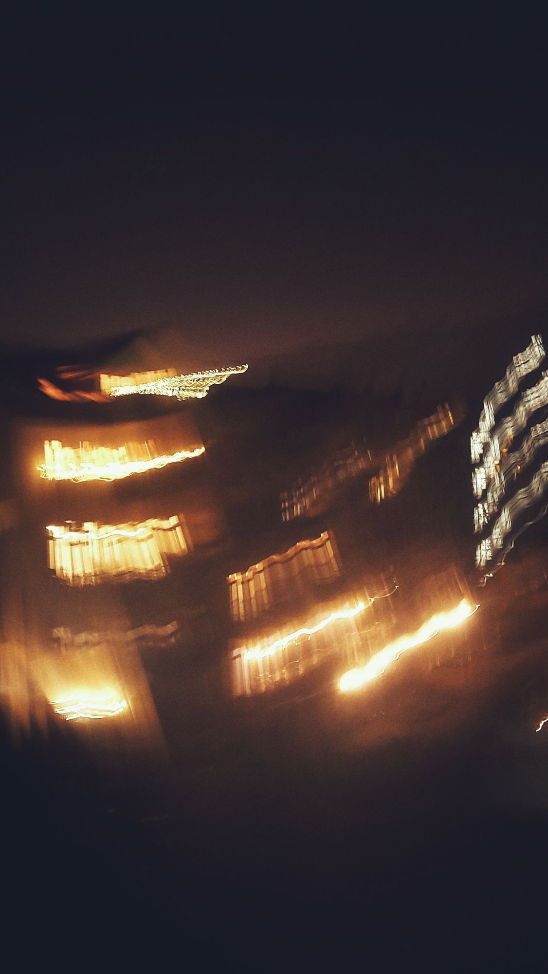 Blurred window lights of a city at night. 