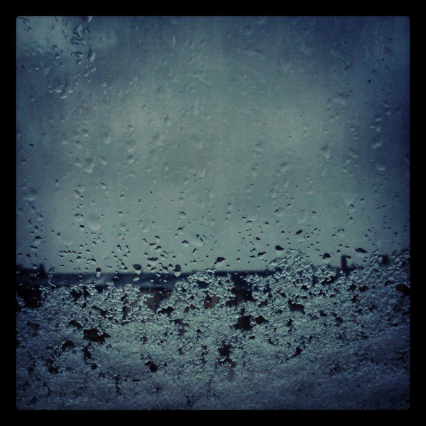 Old image: Snow and ice on a windowpane.