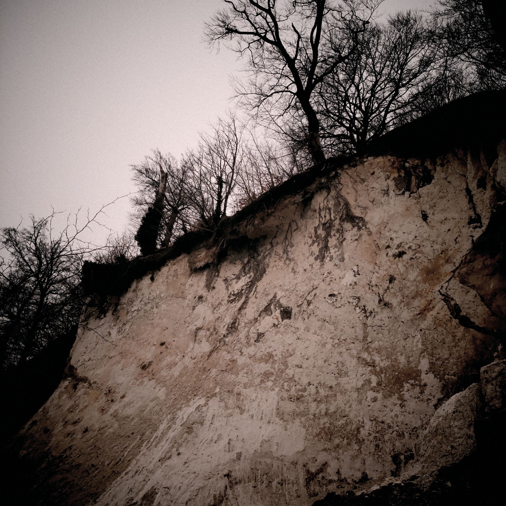 Sandy cliff coast, seen from below.