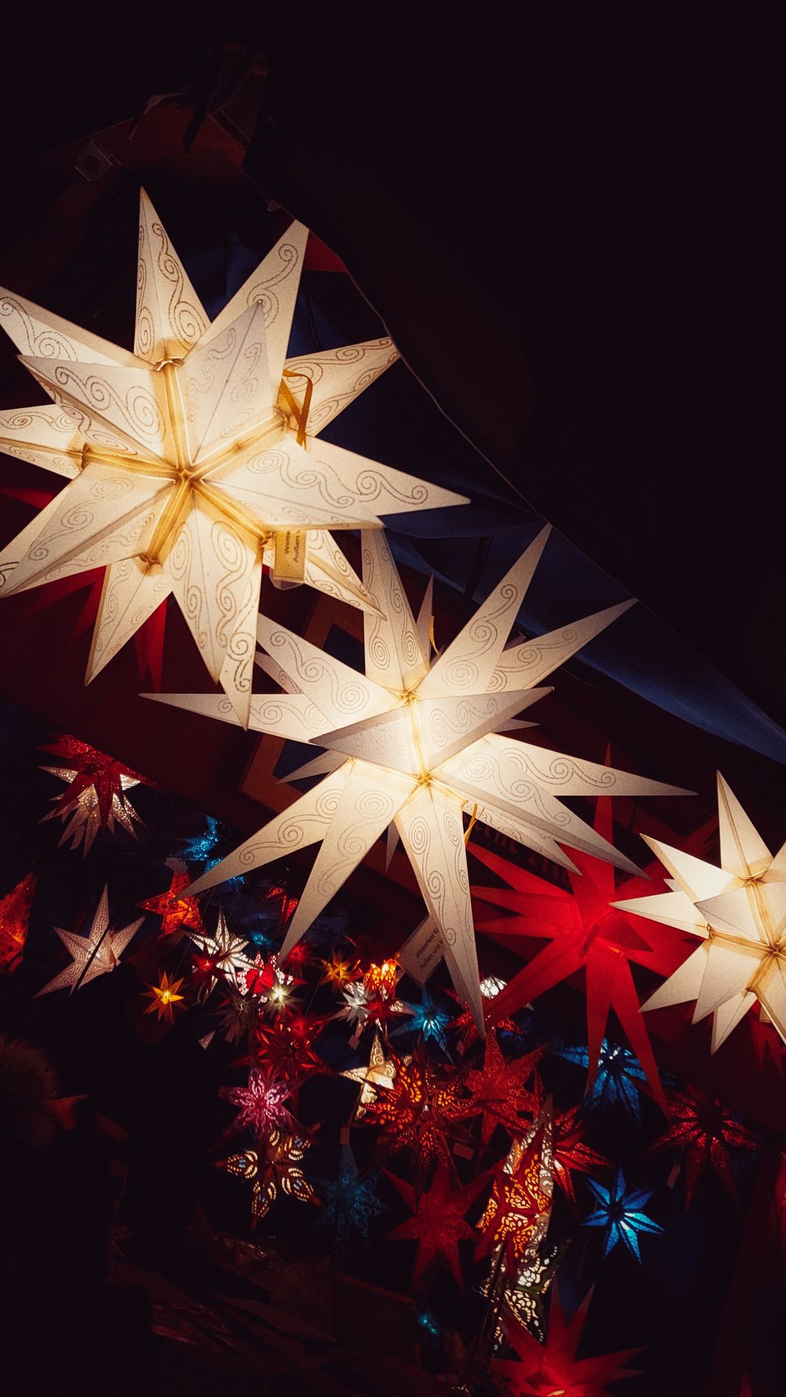 A collection of Christmas stars, different colours and sizes