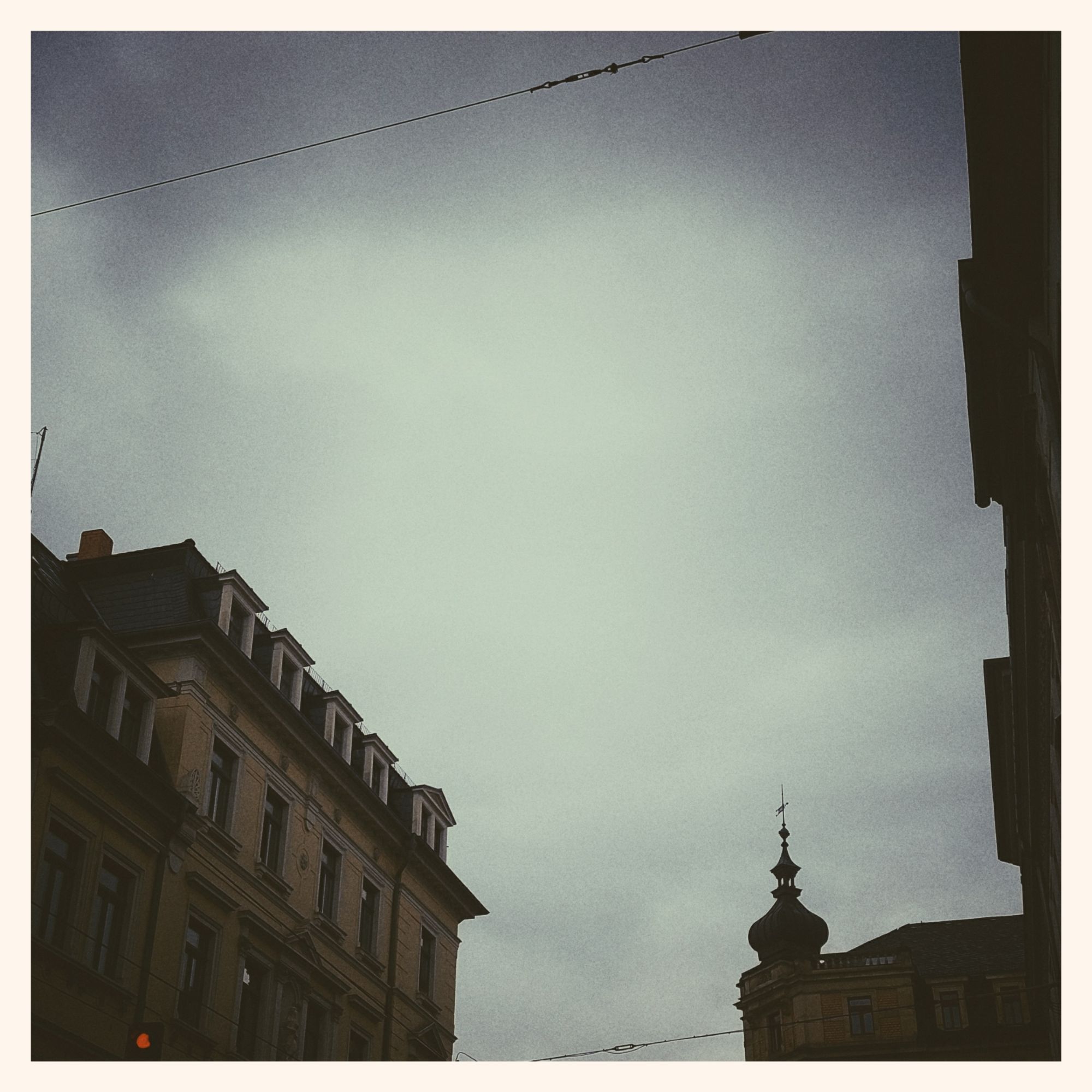 Rain clouds above old houses.